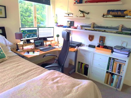 Picture of a bed and desk workplace