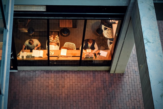 Image of people working by window